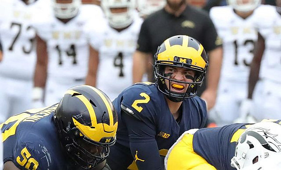 Michael Onwenu (50) and Shea Patterson (2)