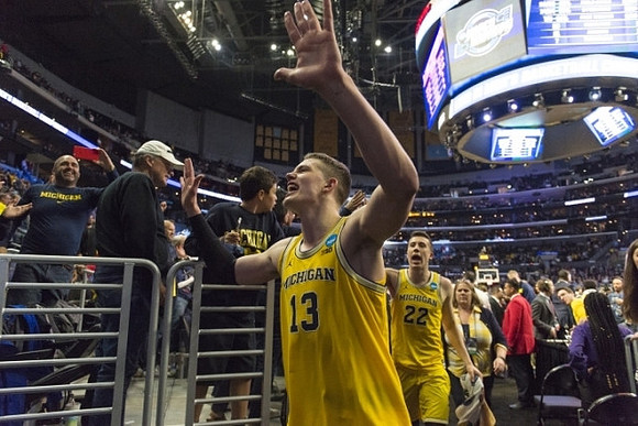 Moritz Wagner (13) and Duncan Robinson (22)