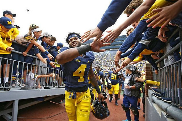 Nico Collins (4) and Cesar Ruiz (51)