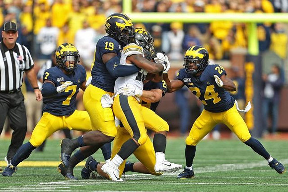 Khaleke Hudson (7), Kwity Paye (19), Jordan Glasgow (29), and Lavert Hill (24)
