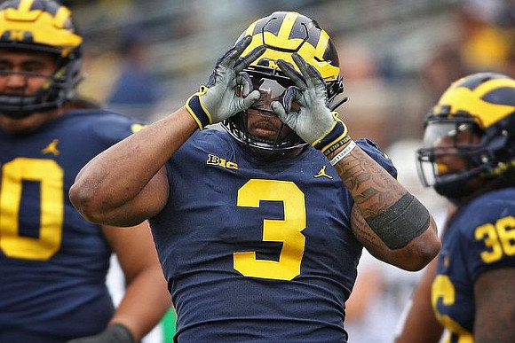 Bryan Mone (90), Rashan Gary (3), and Devin Gil (36)