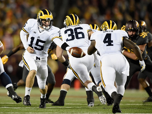 Jake Rudock (15), Joe Kerridge (36), and De'Veon Smith (4)
