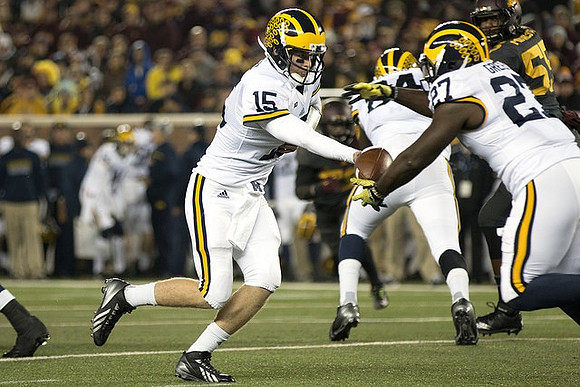 Jake Rudock (15), A.J. Williams (84), and Derrick Green (27)