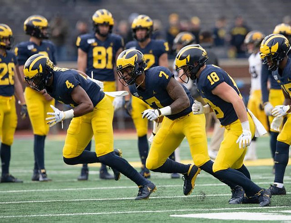 Nico Collins (4), Tarik Black (7), and Brendan White (18)