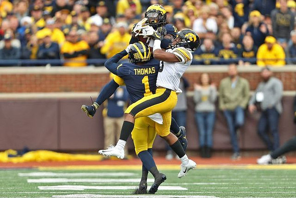 Josh Metellus (14) and Ambry Thomas (1)