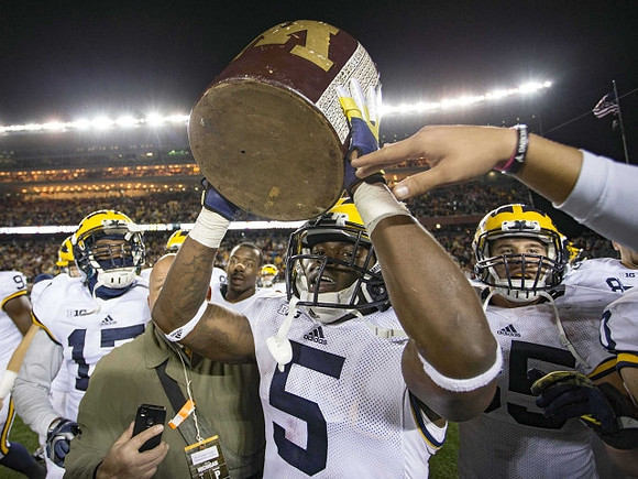 Freddy Canteen (17), Jabrill Peppers (5), Joe Bolden (35), and The Little Brown Jug