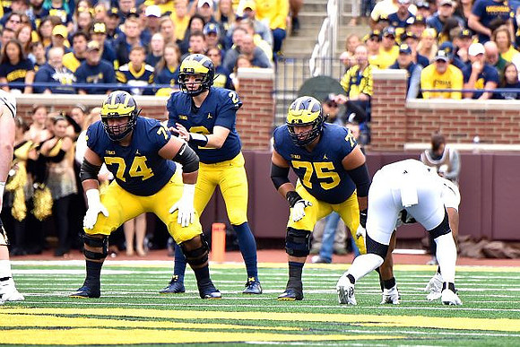 Ben Bredeson (74), Shea Patterson (2), and Jon Runyan Jr. (75)