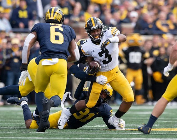 Josh Uche (6) and Vincent Gray (31)