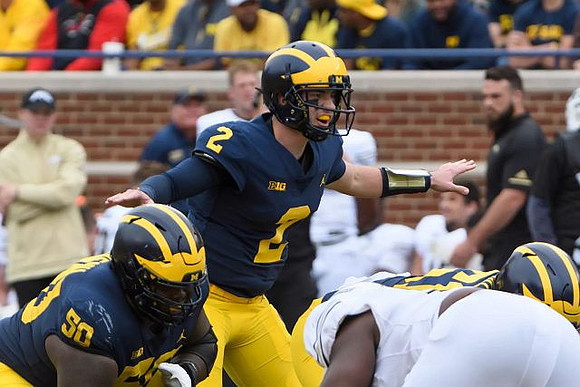 Michael Onwenu (50), Shea Patterson (2), and Cesar Ruiz (51)
