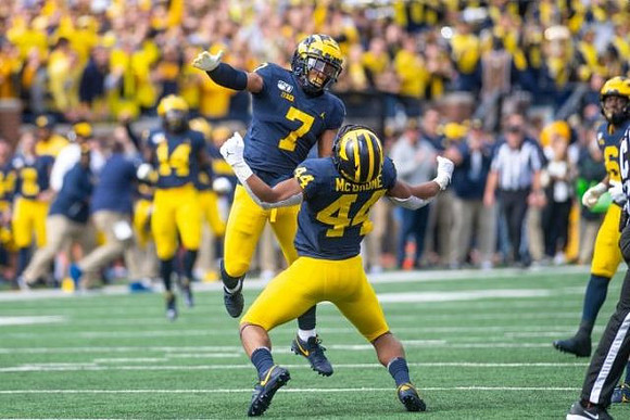 Cameron McGrone (44) and Khaleke Hudson (7)