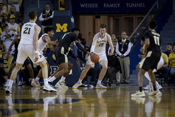 Franz Wagner (21), Eli Brooks (55), and Jon Teske (15)
