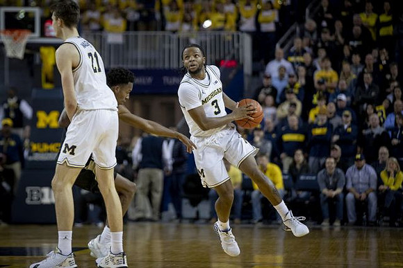 Franz Wagner (21) and Zavier Simpson (3)