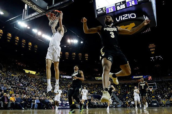 Franz Wagner (21), Zavier Simpson (3), Brandon Johns Jr. (23), and Austin Davis (51)