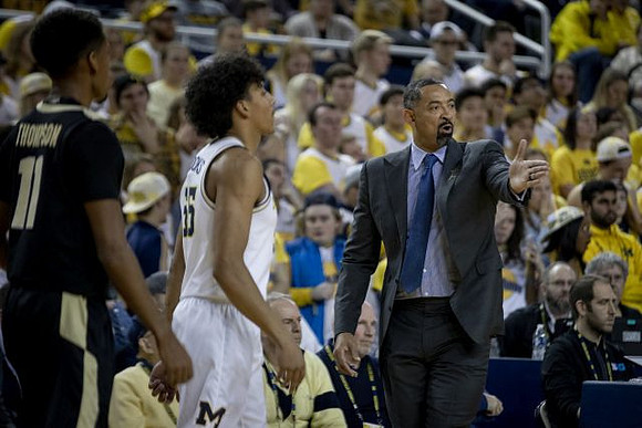 Eli Brooks (55) and Juwan Howard