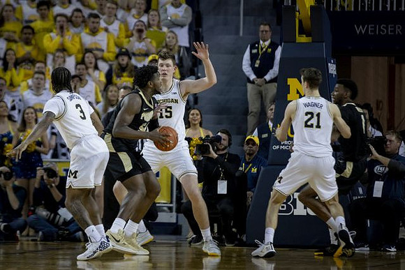 Zavier Simpson (3), Jon Teske (15), and Franz Wagner (21)