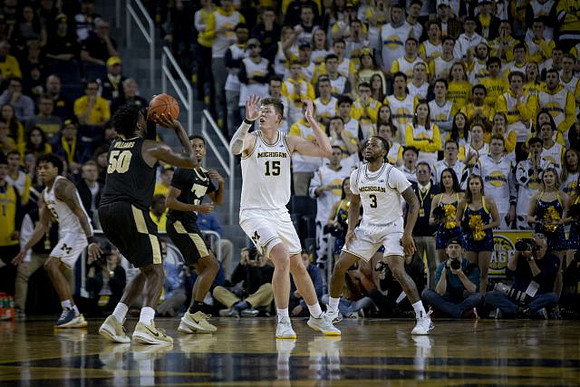 Eli Brooks (55), Jon Teske (15), and Zavier Simpson (3)