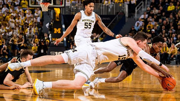 Eli Brooks (55) and Jon Teske (15)