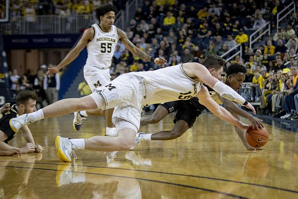 Eli Brooks (55) and Jon Teske (15)