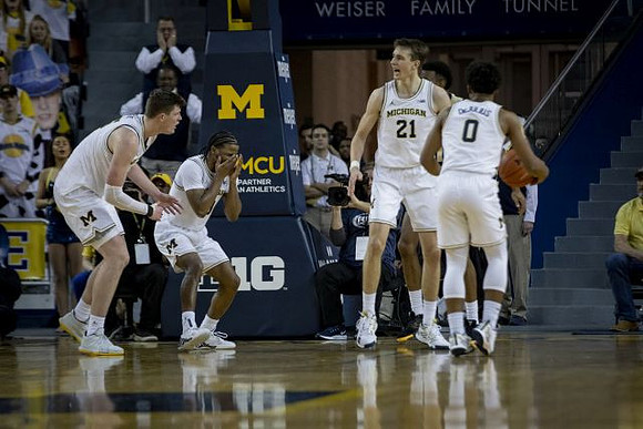 Jon Teske (15), Zavier Simpson (3), Franz Wagner (21), and David DeJulius (0)