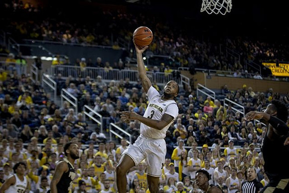 Zavier Simpson (3) and Eli Brooks (55)