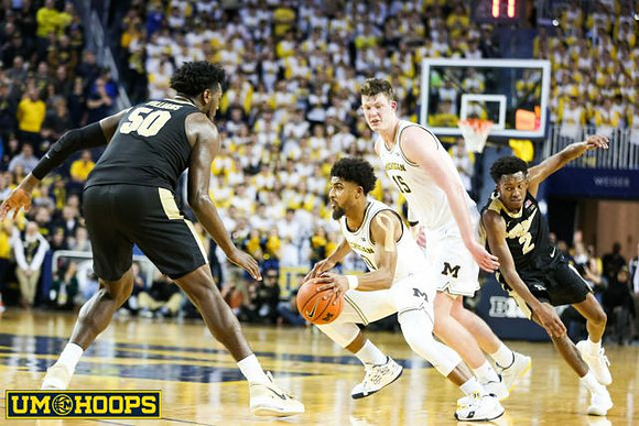 David DeJulius (0) and Jon Teske (15)