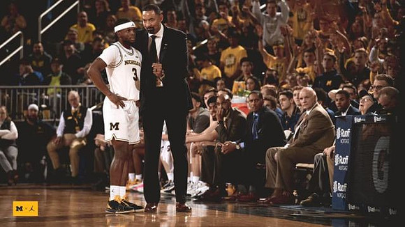 Zavier Simpson (3) and Juwan Howard