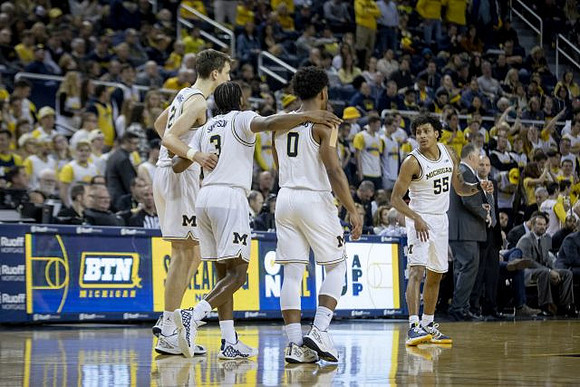 Franz Wagner (21), Zavier Simpson (3), David DeJulius (0), and Eli Brooks (55)