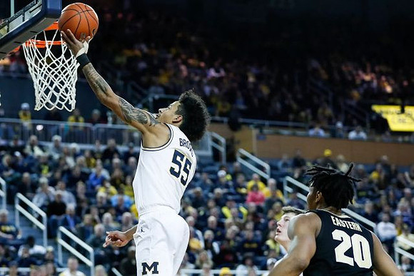 Eli Brooks (55) and Jon Teske (15)