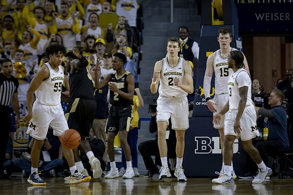 Eli Brooks (55), Franz Wagner (21), Jon Teske (15), and Zavier Simpson (3)