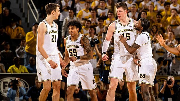 Franz Wagner (21), Eli Brooks (55), Jon Teske (15), and Zavier Simpson (3)