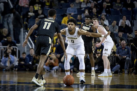 David DeJulius (0) and Jon Teske (15)