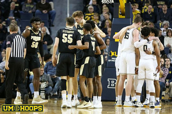 Jon Teske (15), David DeJulius (0), and Eli Brooks (55)