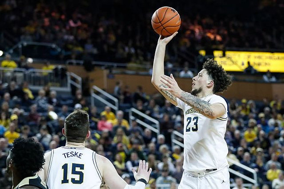 Jon Teske (15) and Brandon Johns Jr. (23)