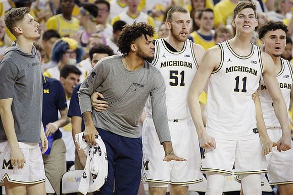 Cole Bajema (22), Isaiah Livers (2), Austin Davis (51), Colin Castleton (11), and Adrien Nunez (5)