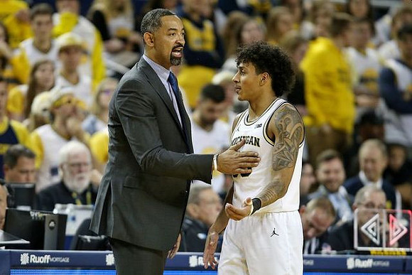 Juwan Howard and Eli Brooks (55)