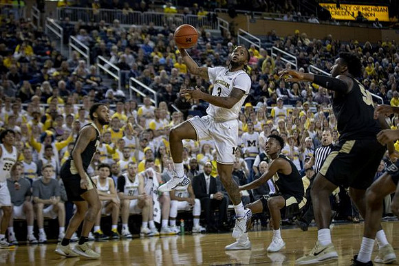 Zavier Simpson (3) and Eli Brooks (55)