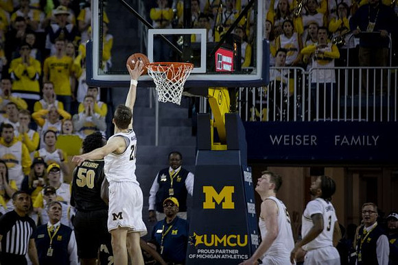 Franz Wagner (21), Jon Teske (15), and Zavier Simpson (3)