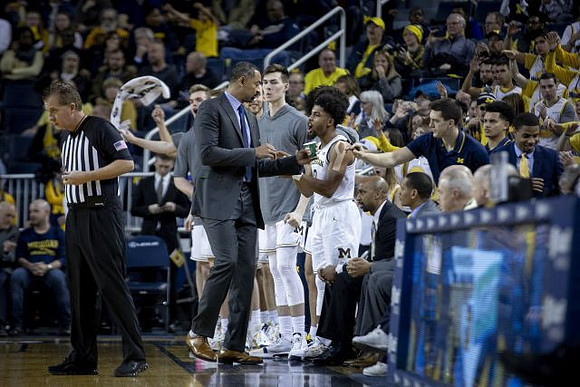 Juwan Howard, Colin Castleton (11), David DeJulius (0), Saddi Washington, and Howard Eisley