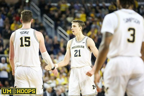 Jon Teske (15), Franz Wagner (21), and Zavier Simpson (3)