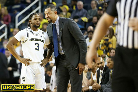 Zavier Simpson (3) and Juwan Howard