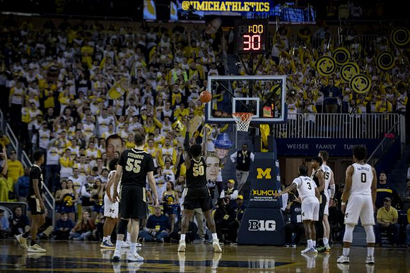 Eli Brooks (55), Zavier Simpson (3), Jon Teske (15), and David DeJulius (0)
