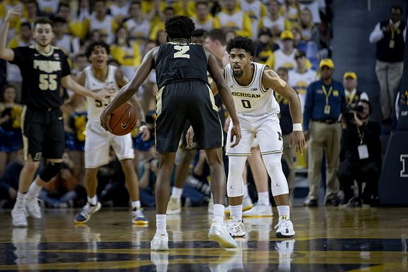 Eli Brooks (55) and David DeJulius (0)