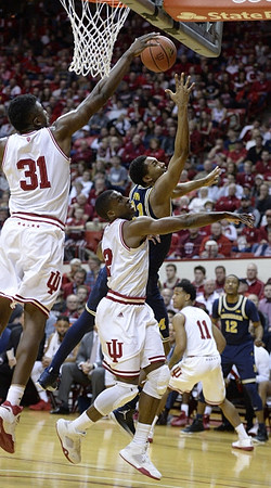 Zak Irvin (21) and Muhammad-Ali Abdur-Rahkman (12)