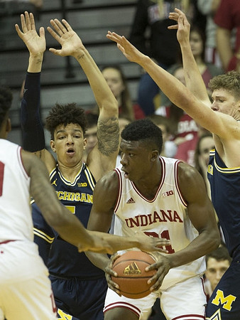 D.J. Wilson (5) and Moritz Wagner (13)