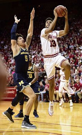 Derrick Walton Jr. (10) and D.J. Wilson (5)