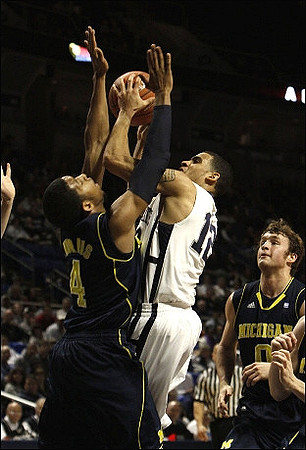 Darius Morris (4) and Zack Novak (0)