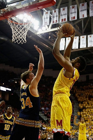 Derrick Walton Jr. (10) and Mark Donnal (34)