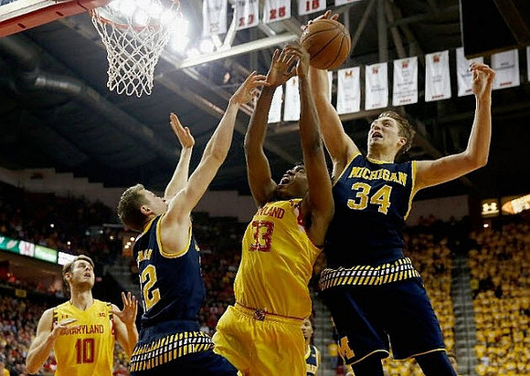 Duncan Robinson (22) and Mark Donnal (34)