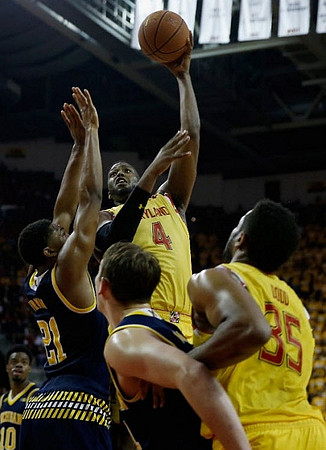 Zak Irvin (21) and Mark Donnal (34)