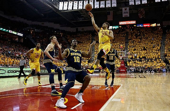 Mark Donnal (34), Derrick Walton Jr. (10), and Muhammad-Ali Abdur-Rahkman (12)